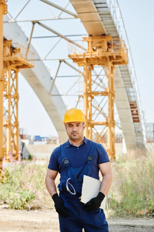 Facility worker logging condition data in the field — the workforce we invest in through paid internships, scholarships, and open methodology